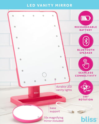 The LED Vanity Mirror (with Built-In Speaker & Hands-Free Calling) by bliss boasts a pink frame and stand, a rechargeable battery, Bluetooth speaker for hands-free calling, seamless connectivity, and 180° rotation. Durable LED lights illuminate your beauty routine while the included 10x magnifying mirror and USB cable add an extra layer of convenience.