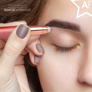 Close-up of a person using the Perfect Brows Precision Brow Shaver with LED Light in rose gold to shape their eyebrow with painless precision. The shaver, featuring an integrated precision LED light, is held near the end of the brow, with the person's eyes closed. "California Almost Famous" and "AF" text adorns the top corners.