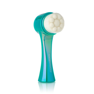 The "Cleanse It" 2in1 Exfoliator Brush (2-Pack) by Almost Famous features a teal-colored handle ergonomically designed for a comfortable grip, with a slight curve. The rounded, textured white bristle head has a soft, clustered design that effectively cleans and helps reveal radiant skin.