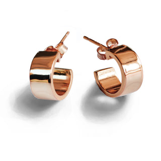 A pair of shiny rose gold Boss Chubby Mini Hoops Earrings from Sonia Hou Jewelry with a smooth, reflective surface. The open-ended, confident hoops fasten with stud backs. Placed on a plain white background, the earrings cast soft shadows, making them an elegant yet bold accessory.