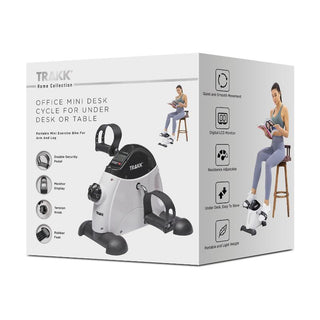 A product image of the Trakk Office & Under Desk Exercise Bike with LCD Display. The box showcases this compact design, a portable mini exercise bike perfect for under desk or table use. It highlights features such as smooth movement, an LCD monitor, adjustable resistance, and easy portability.