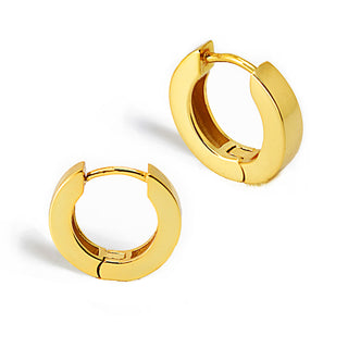 The Essential Huggies from Sonia Hou Jewelry are a pair of small, polished gold huggie earrings. These lightweight earrings feature a smooth, glossy finish and are designed to fit closely to the ear. The simple, elegant design includes a hinged closure for easy wearing and is versatile enough for any occasion.