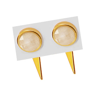 A close-up of the Fire White Quartz 3-Way Earrings by Sonia Hou Jewelry, showing a pair of gold-toned studs with round, faceted white quartz in a bezel setting. Embodying fierce confidence, these earrings are displayed on a white background, each stud attached to gold-toned posts.