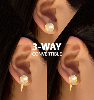 Close-up images showcase an ear adorned with the Fire White Quartz 3-Way Earrings from Sonia Hou Jewelry, featuring a powerful gemstone in three striking styles. Wear it as a simple stud, add an extra drop beneath, or attach a circular hoop. The text reads "3-WAY CONVERTIBLE".