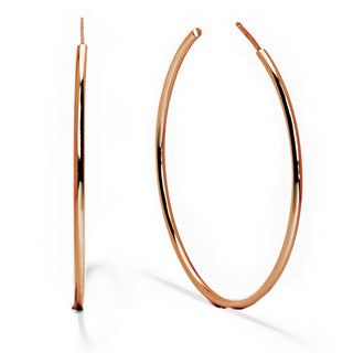 A pair of thin, polished rose gold hoop earrings crafted from quality materials by Sonia Hou Jewelry. The Perfect Hoop Earrings are circular with a smooth, reflective surface; one stands upright while the other lies flat at an angle, both set against a white background.