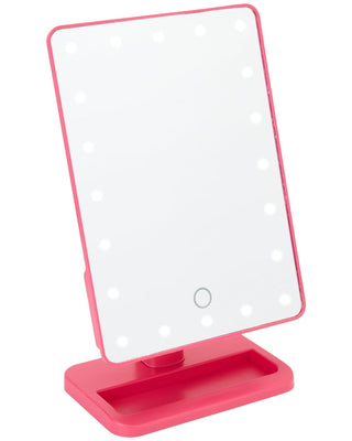 Introducing the bliss LED Vanity Mirror (with Built-In Speaker & Hands-Free Calling): a rectangular lighted makeup mirror with a pink frame, surrounded by white LED lights. Mounted on a matching pink stand with an accessory tray, it features an integrated Bluetooth speaker for music and hands-free calling.