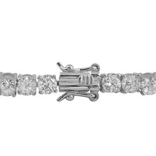 A close-up of the Genevieve White Gold Plated Tennis Bracelet with Cubic Zirconia showcases a secure, centrally positioned clasp mechanism. This elegant accessory features a continuous line of round, clear cubic zirconia stones set in sleek, polished metal, with the prominently detailed clasp adding to its sophisticated design.